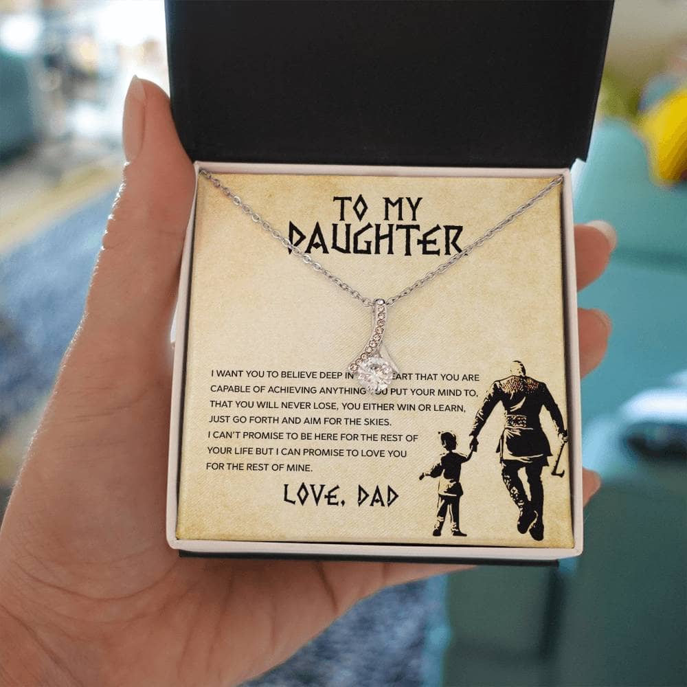 Alt text: "A hand holding a Personalized Daughter Necklace in a mahogany-like box with LED lighting."