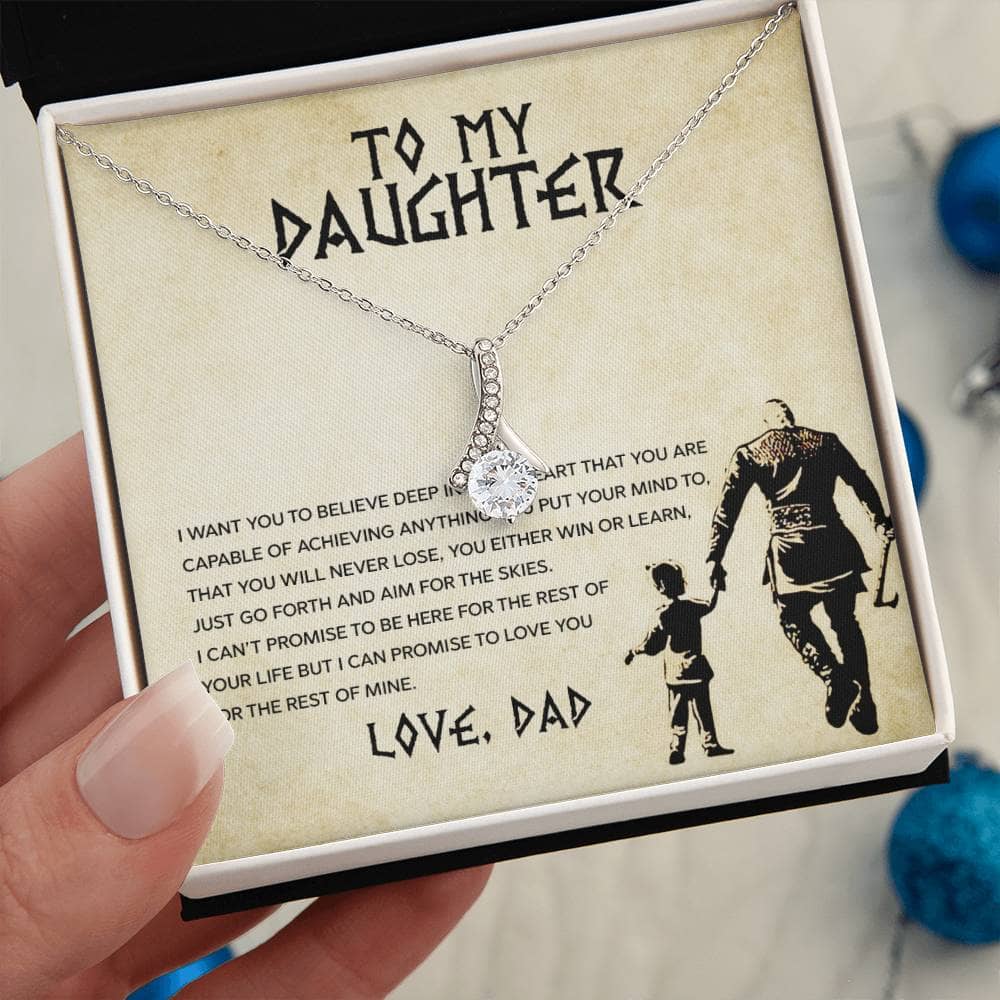 Alt text: "Hand holding Personalized Daughter Necklace in a box, symbolizing enduring parent-child love and sentiment. Made with cushion-cut cubic zirconia and heart-shaped pendant. Adjustable chain for versatile styling. Packaged in a luxurious box with LED lighting. Crafted by Bespoke Necklaces."