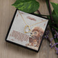 A necklace in a box with a lion and leaf design, part of the "To My Daughter" Necklace Collection.
