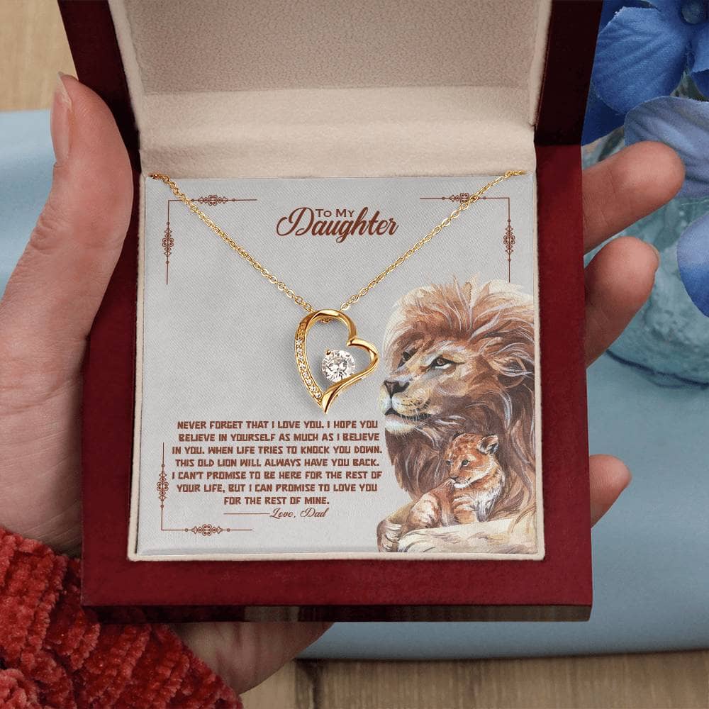 A hand holding a personalized daughter necklace in a box, beautifully presented with LED lighting.
