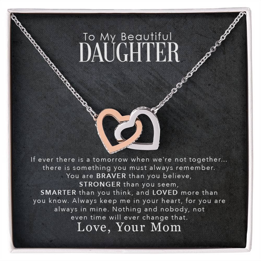 A necklace with two hearts in a box, symbolizing the unbreakable bond between parents and daughters. The pendant features a cushion-cut cubic zirconia, adding elegance and strength. The adjustable chain ensures a perfect fit for any daughter. Packaged in a lavish mahogany-style box with an LED spotlight for an unforgettable unboxing experience. The ideal gift for remarkable milestones, birthdays, holidays, or as a pleasant surprise.