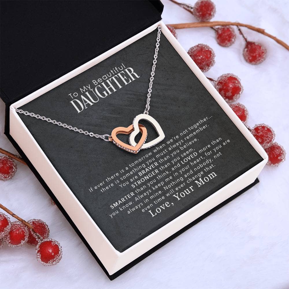 A personalized daughter necklace with a cushion-cut zirconia pendant, elegantly packaged in a mahogany-style box with LED lighting.