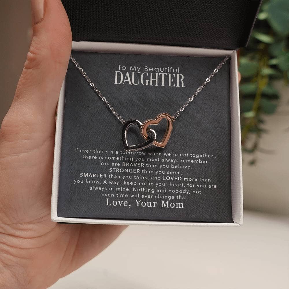 Alt text: "Hand holding Personalized Daughter Necklace with Cushion-Cut Zirconia Pendant"