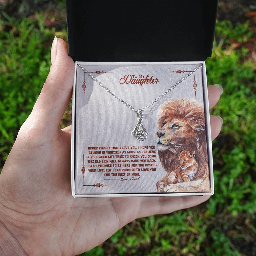 Alt text: "Hand holding 'To My Daughter' necklace in a luxurious box with LED lighting"