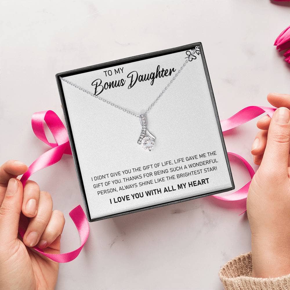 Alt text: "Hands holding a Personalized Daughter Necklace with Heart-shaped Pendant in a luxurious box"