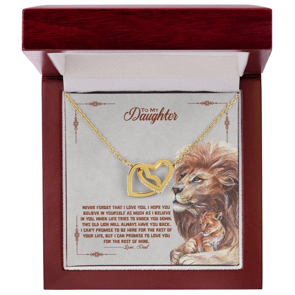 Alt text: "Interlocking Hearts necklace in mahogany box with LED lighting, symbolizing unshatterable bond between parent and child."