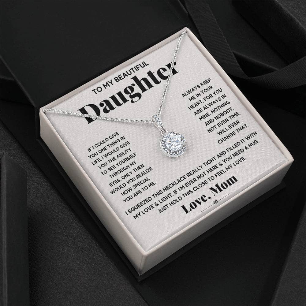 A personalized daughter necklace with a heart pendant featuring cubic zirconia stones, symbolizing the enduring bond between parent and daughter.