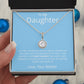 A hand holding a premium personalized daughter necklace with a heart-shaped pendant and cubic zirconia stone in a mahogany-style box.