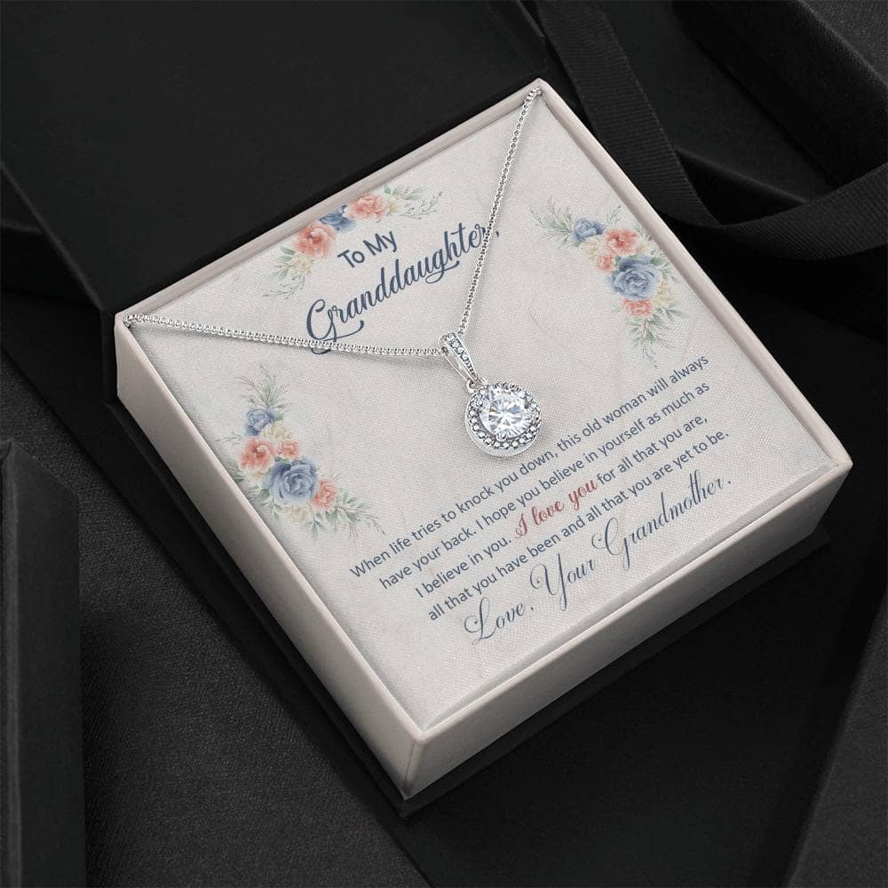 Alt text: "Personalized Granddaughter Eternal Hope Necklace - Heart-shaped pendant with cubic zirconia crystal on adaptable chain, presented in a luxurious mahogany-style gift box with LED spotlight."