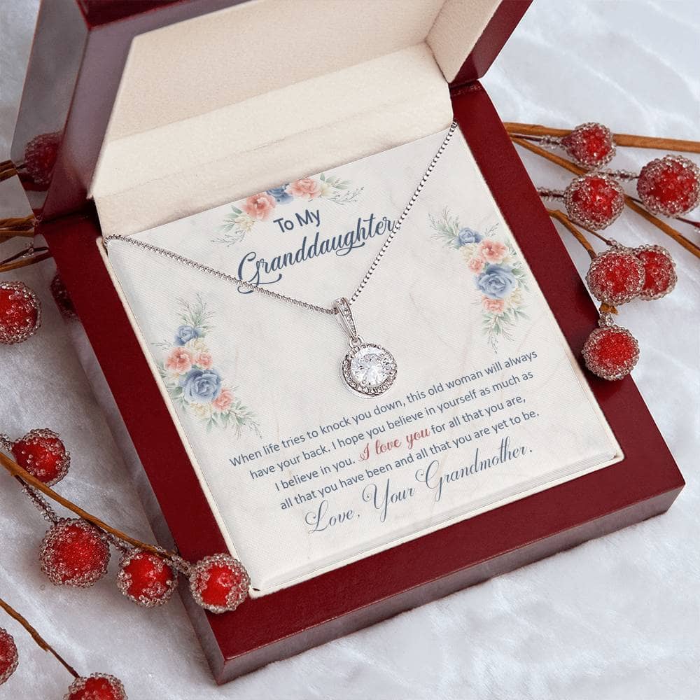Alt text: "Personalized Granddaughter Eternal Hope Necklace - Heart-shaped pendant with cubic zirconia crystal on an adaptable chain, presented in a luxurious mahogany-style gift box with LED spotlight."