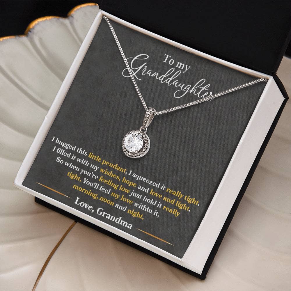 A personalized granddaughter heart necklace, featuring a dazzling cubic zirconia pendant in a box.