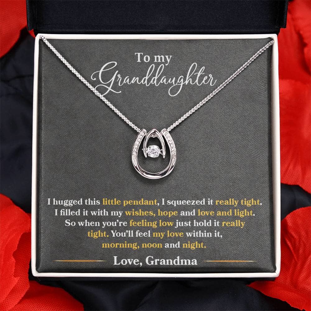 A necklace in a box, Personalized Granddaughter Love Necklace, with a heart-shaped pendant and adjustable chain for optimal comfort.