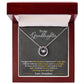 Alt text: "Personalized Granddaughter Love Necklace in a box, featuring a heart-shaped pendant and cubic zirconia center."