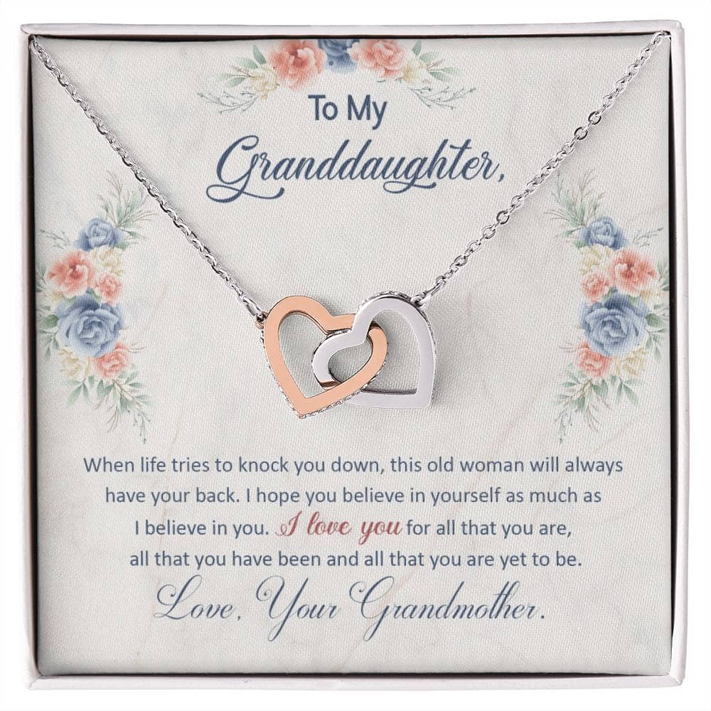 A necklace in a box, showcasing a heart-shaped pendant and adjustable chains. Personalized Granddaughter Love Pendant, a symbol of the unyielding bond between a granddaughter and her grandparents. Crafted with high-grade cubic zirconia, it exudes durability and elegance. Presented in a luxurious mahogany-styled box with LED lighting enhancement. A timeless token of love, perfect for gifting.