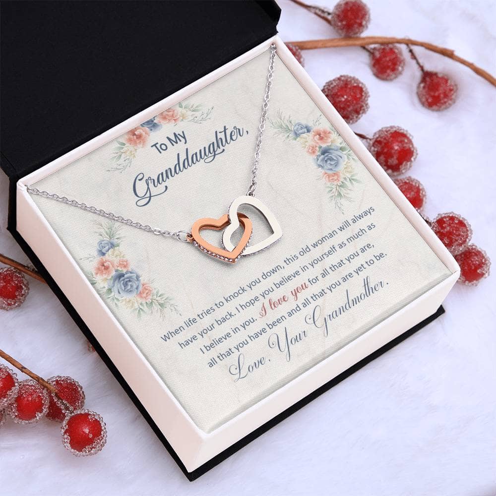 Alt text: "Personalized Granddaughter Love Pendant in a box - a stunning necklace with a heart-shaped pendant and adjustable chain, crafted from high-grade cubic zirconia. Presented in a mahogany-styled luxury box with LED lighting. A symbol of the unyielding bond between a granddaughter and her grandparents."