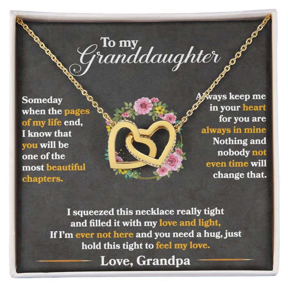 A necklace in a box, featuring a heart-shaped pendant and adjustable chain, symbolizing the bond between grandparents and granddaughters.