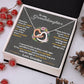 Alt text: "Personalized Granddaughter Love Token Necklace in a box with pine cones, berries, and a heart-shaped pendant"