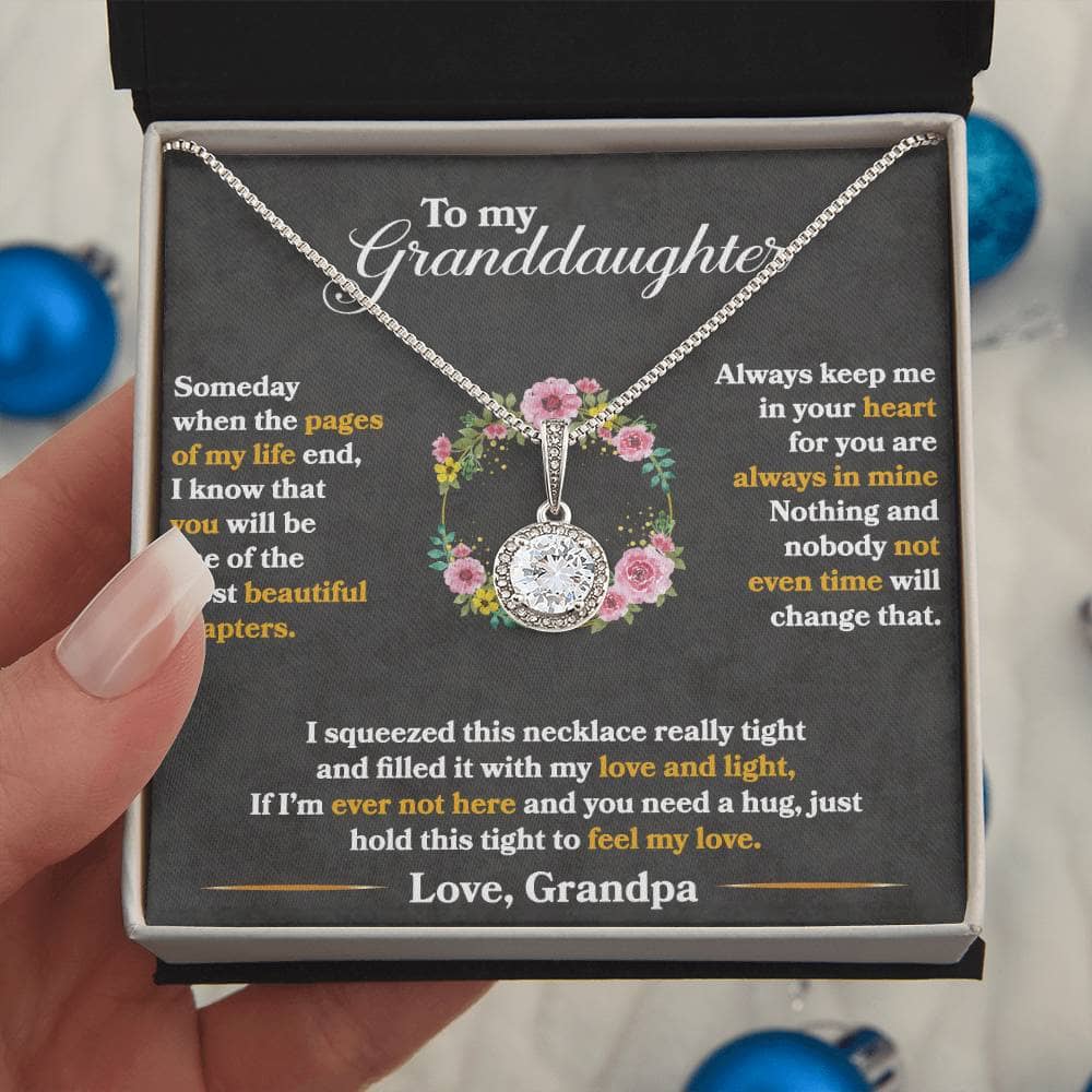 Alt text: "A hand holding a Personalized Granddaughter Necklace in a luxurious box with LED lighting"