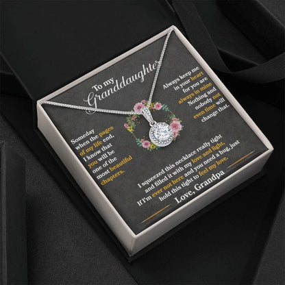 Alt text: "Personalized Granddaughter Necklace - A necklace in a box with a diamond pendant, symbolizing eternal love and affection."