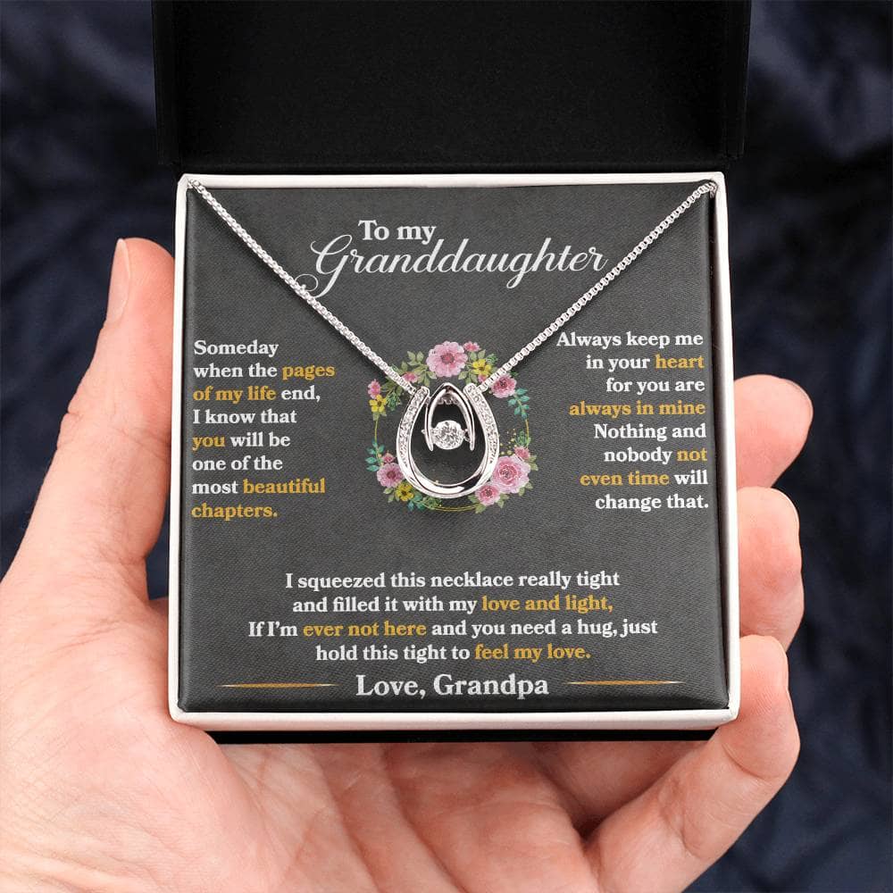 Alt text: "Hand holding Personalized Granddaughter Necklace in box"