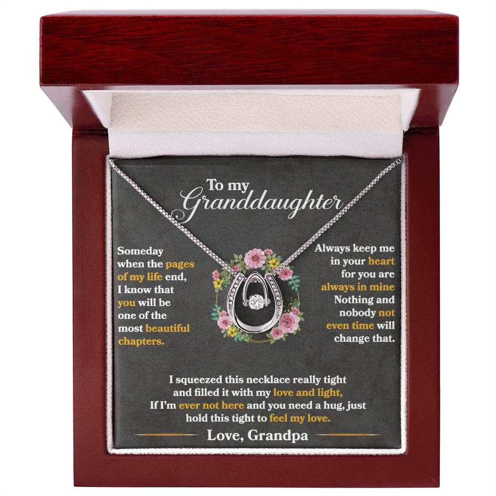 A personalized granddaughter necklace with a heart-shaped pendant and cubic zirconia. Presented in an opulent box, perfect for gifting.