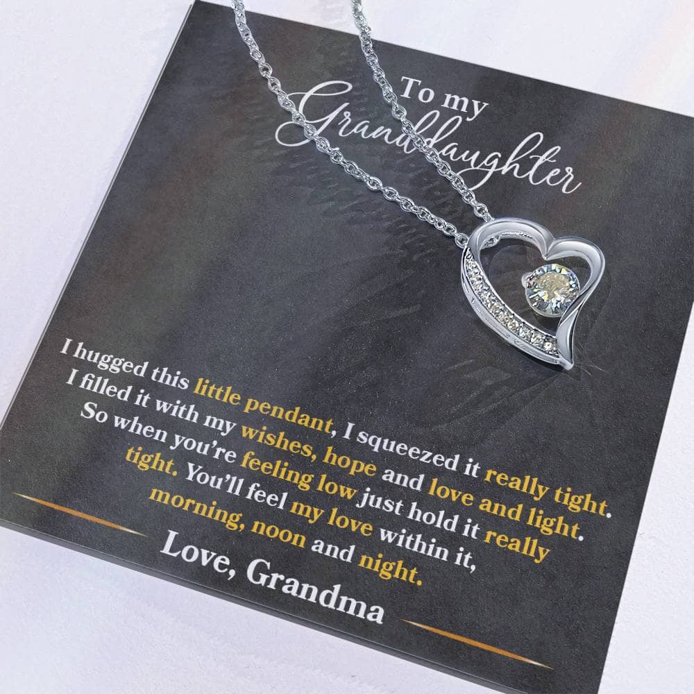 Alt text: "Personalized Granddaughter Necklace - Forever Love Token: Heart-shaped pendant with a dazzling 6.5mm CZ crystal on a silver chain."