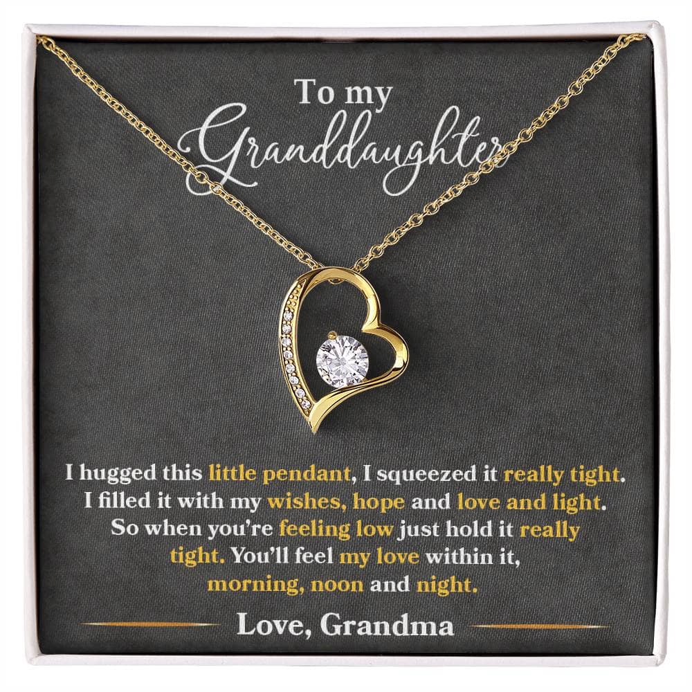 Alt text: "Personalized Granddaughter Necklace - Forever Love Token: A necklace in a box with a gold heart pendant featuring a diamond. Crafted with love, this necklace symbolizes the bond between grandmothers and their grandchildren. Perfect for any occasion."