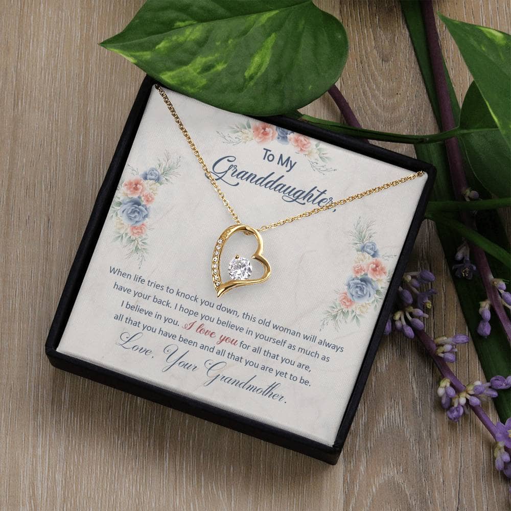 Alt text: "Personalized Granddaughter Necklace in a luxury box with a note and leaves"