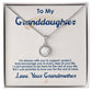 A close-up of a Personalized Granddaughter Necklace with Cubic Zirconia pendant in a box.