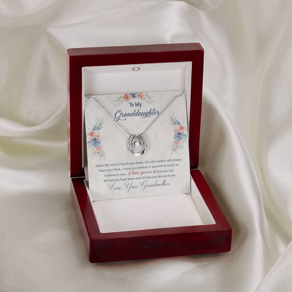 A close-up of a Personalized Granddaughter Necklace with Heart Pendant in a box.