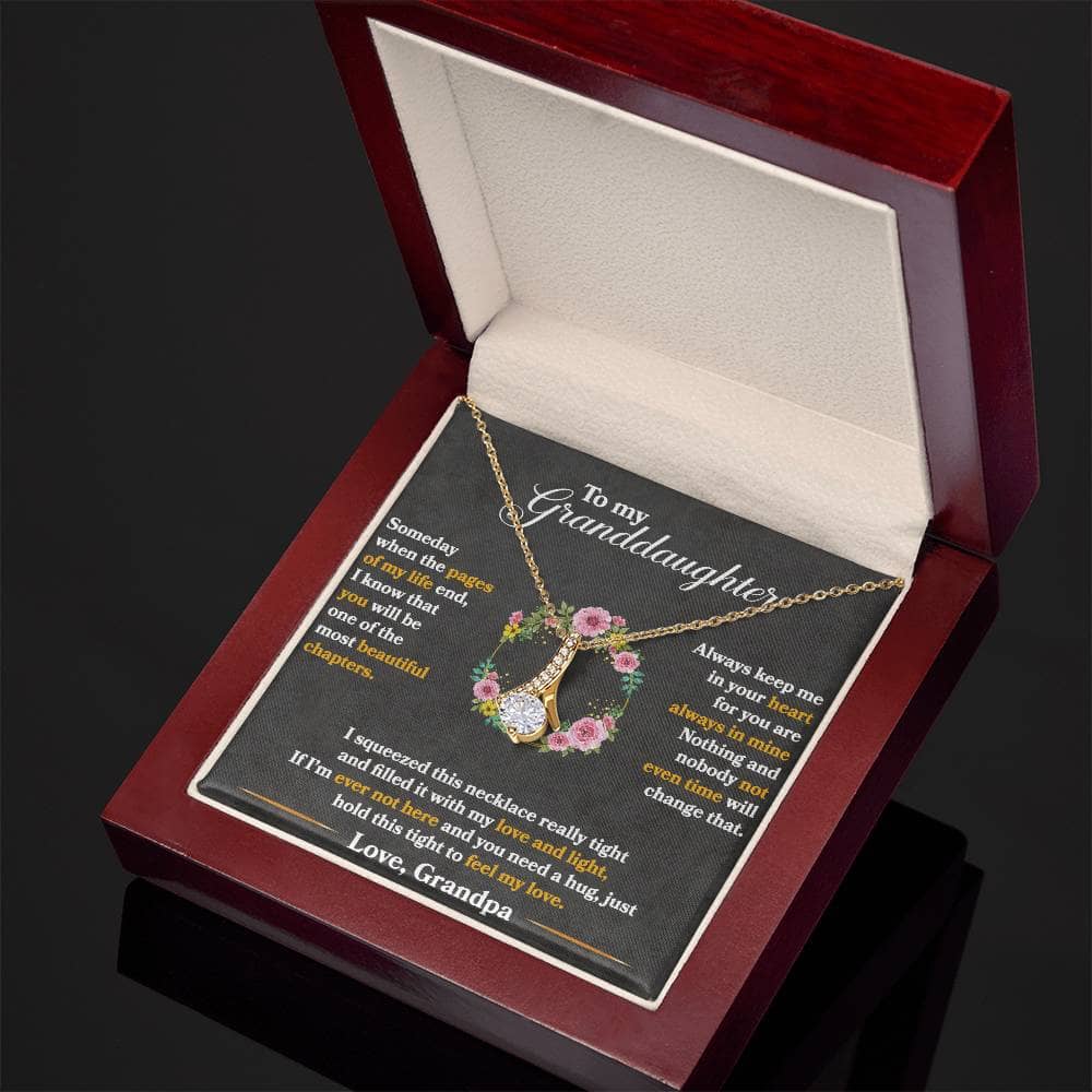 Alt text: "Personalized Granddaughter's Embrace Necklace in an elegant box with LED lighting"