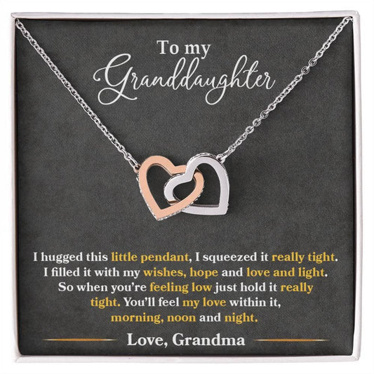 A necklace in a box, personalized for granddaughters. Crafted with premium cubic zirconia, adjustable chains, and a heart-shaped pendant. Comes in a lavish mahogany-style box with LED lighting. Perfect gift for special occasions.