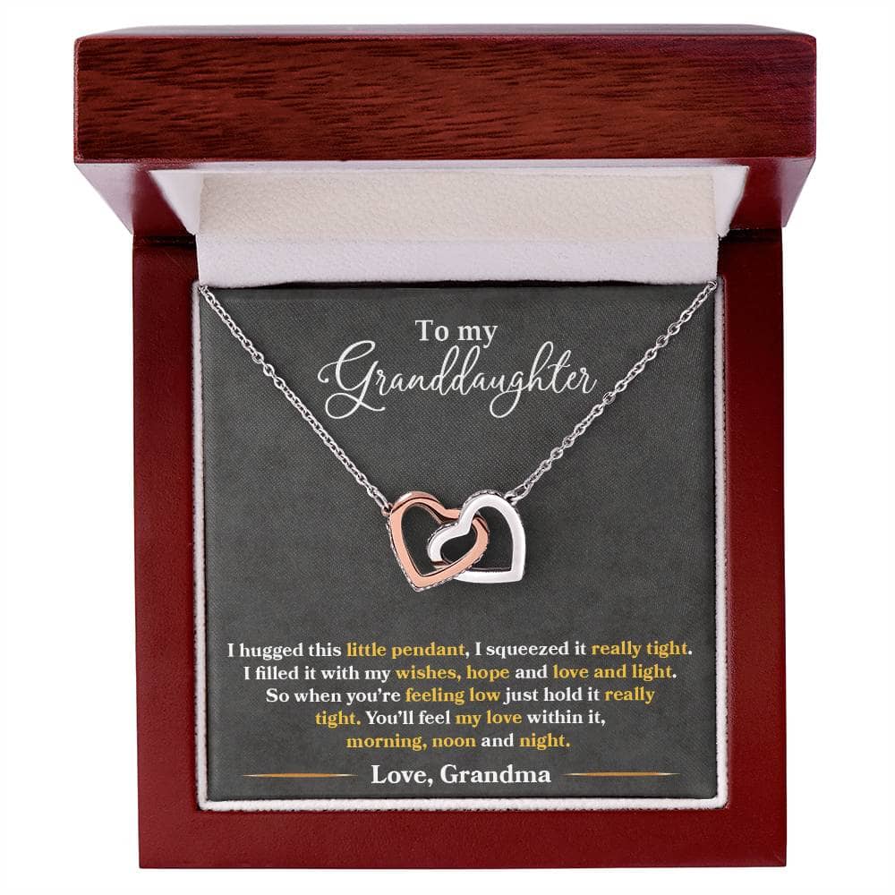 A necklace in a box, featuring two hearts, symbolizing the special bond between grandparents and granddaughters. Perfect for daily wear or special occasions.