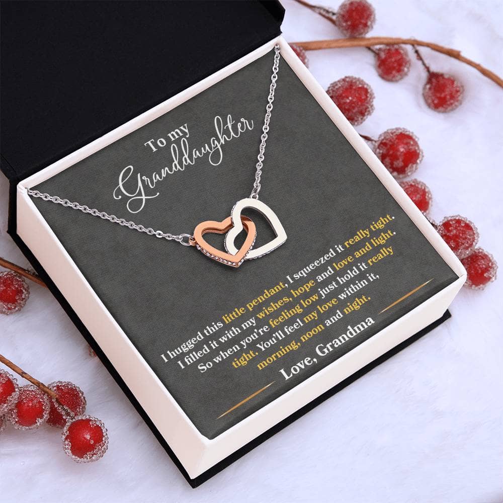 Alt text: "Personalized Love-infused Necklace in a lavish mahogany-style box with LED lighting, symbolizing the bond between grandparents and granddaughters."