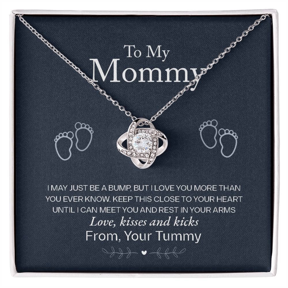 A close-up of a Personalized Mother Necklace - A Gift Of Love From Child, featuring a heart-shaped pendant with a cushion-cut cubic zirconia. Encased in an opulent mahogany-style luxury box with LED lighting for a heart-warming unboxing experience.
