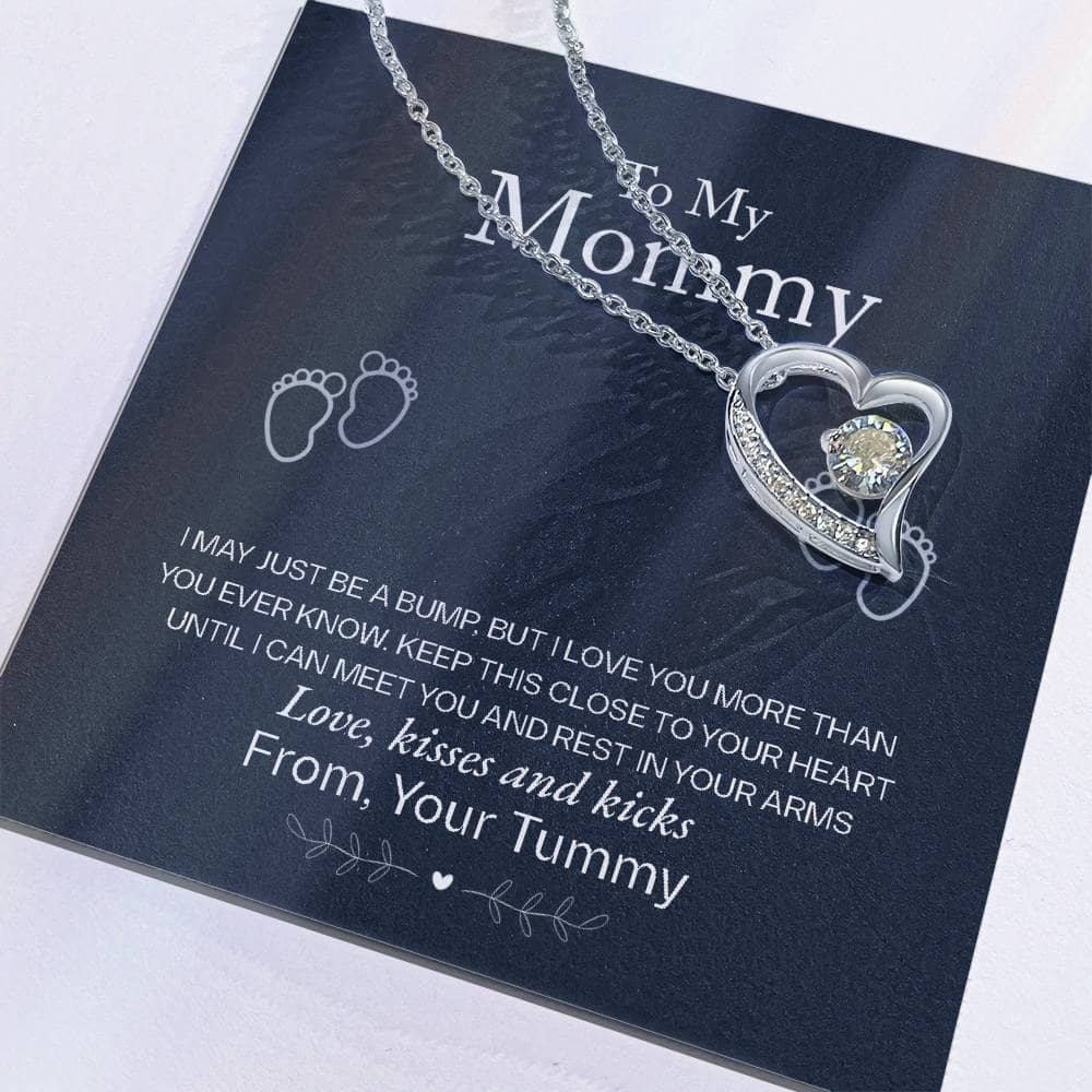 Alt text: "Close-up of heart-shaped necklace on card from the Personalized Mother Necklace - A Gift of Love from Children collection"
