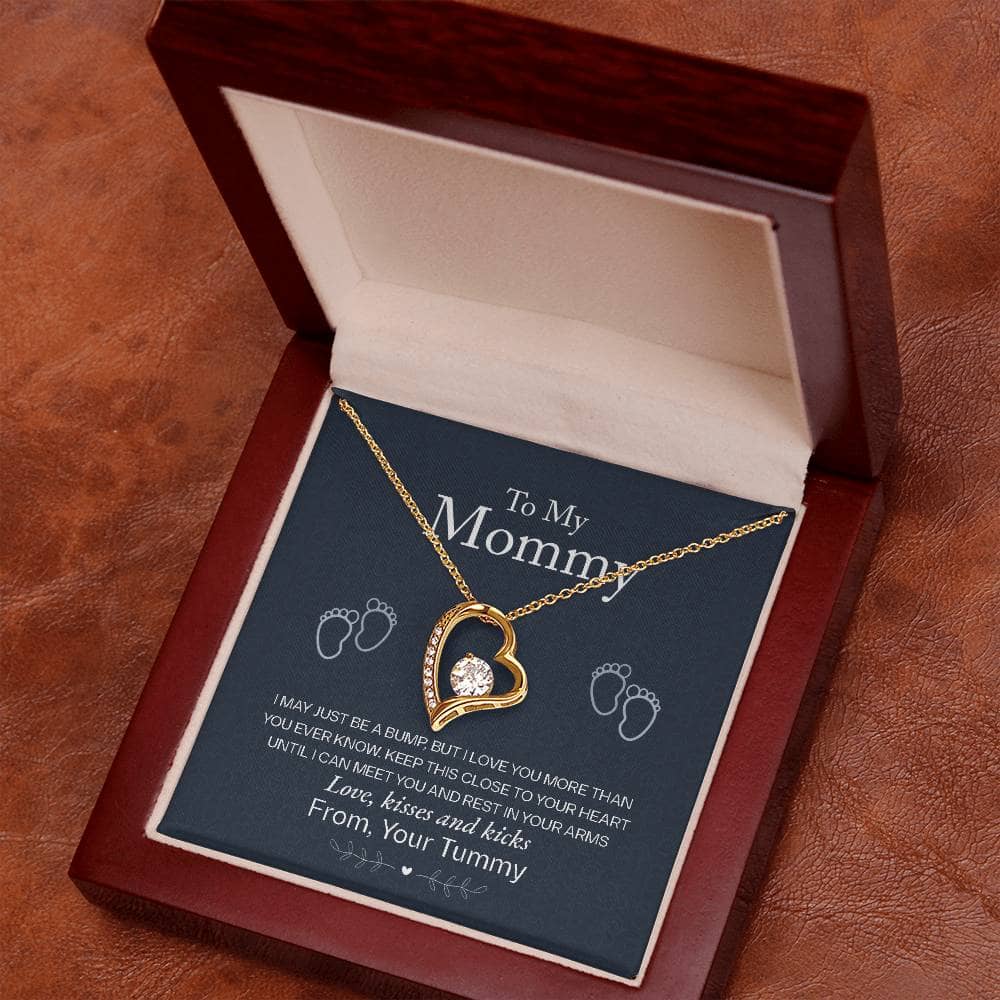 Alt text: "Personalized Mother Necklace - A necklace in a box, symbolizing the enduring love and appreciation for mothers. Featuring a gold heart pendant with a diamond, this elegant piece from the Mother's Embrace Collection celebrates maternal bonds. Suitable for everyday wear and special occasions. Packaged in a luxurious mahogany-style box with LED lighting."