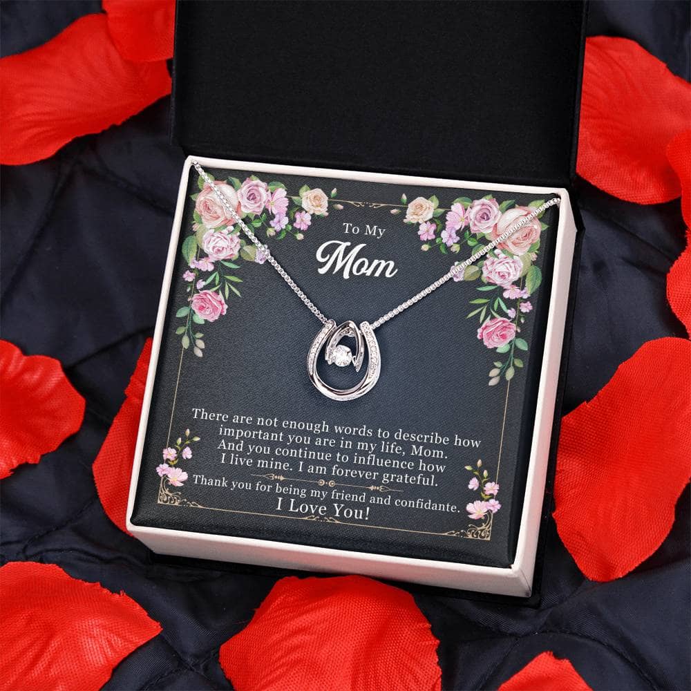 Alt text: "Personalized Mother Necklace - Necklace in a box on a blanket, symbolizing the eternal bond between mother and child"