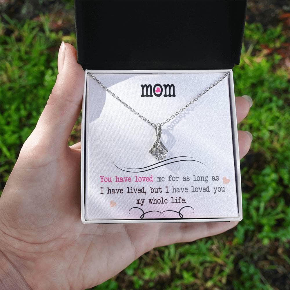 A hand holding a necklace in a box - Personalized Mother Necklace - Elegant Heart Pendant Gift From Child.