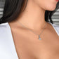 A woman wearing a Personalized Mother Necklace with an elegant heart pendant.