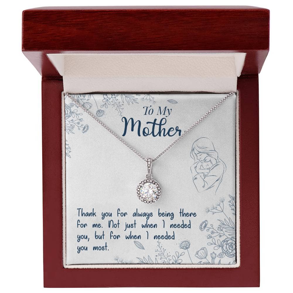 A necklace in a box, featuring a Luxurious Cushion-Cut Cubic Zirconia stone pendant in the shape of a heart. The pendant is adorned with a 8mm cushion-cut centre cubic zirconia crystal, highlighted with side CZ crystals. The necklace is adjustable and comes with a choice of a cable chain or a box chain. Perfect for expressing love and appreciation for mothers.