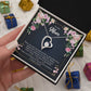 Alt text: "A hand holding a Personalized Mother Necklace - Forever Love Pendant Gift in a box"