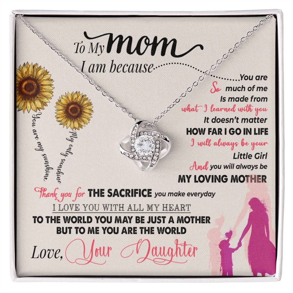 alt: "A personalized mother necklace in a box, featuring a heart-shaped pendant and a diamond pendant on an adjustable chain. The necklace is a tribute of love and connection, handcrafted from premium materials. Comes in a regal mahogany-style box with LED lighting for a magical unboxing experience."