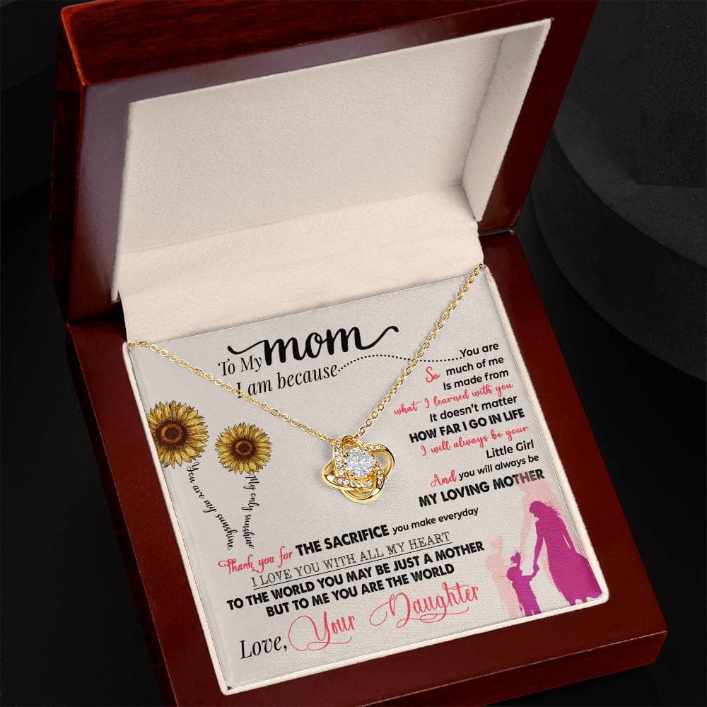 Alt text: "Personalized Mother Necklace in a regal mahogany-style box with LED lighting, featuring a heart-shaped pendant and cushion-cut cubic zirconia."