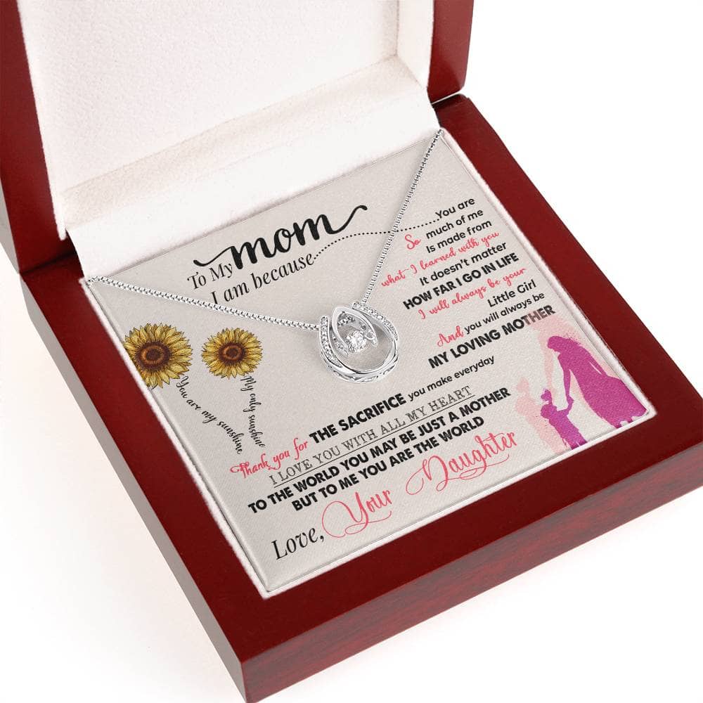 Alt text: "Personalized Mother Necklace in a box - a symbol of maternal love and strength, adorned with sparkling cubic zirconia crystals. Adjustable chain for a perfect fit. Expertly crafted with white gold over stainless steel. Pendant size: 0.77” x 0.62” inches."