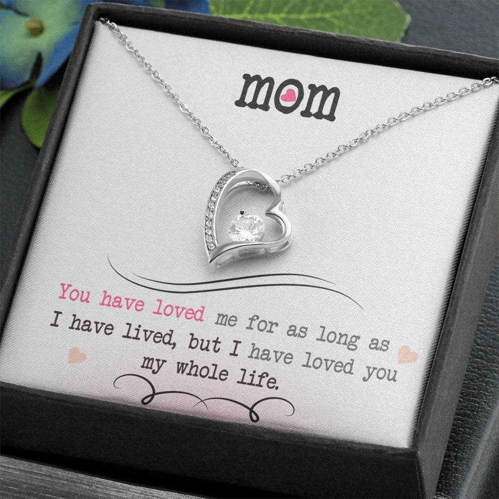 A necklace in a box, personalized for mothers, symbolizing undying love and connection. Made with supreme materials, adorned with a cushion-cut cubic zirconia. Adjustable chain styles available. Perfect for daily wear or special occasions. Comes in a luxury box with LED lighting. Celebrate the eternal bond between mother and child.