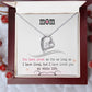 A necklace in a box, featuring a heart-shaped pendant. A symbol of undying love for mothers. Made with supreme materials, adorned with a cushion-cut cubic zirconia. Adjustable chain styles available. Perfect for daily wear or special occasions. Luxuriously presented in a mahogany-style box with LED lighting. A meaningful emblem of the eternal bond between mother and child.