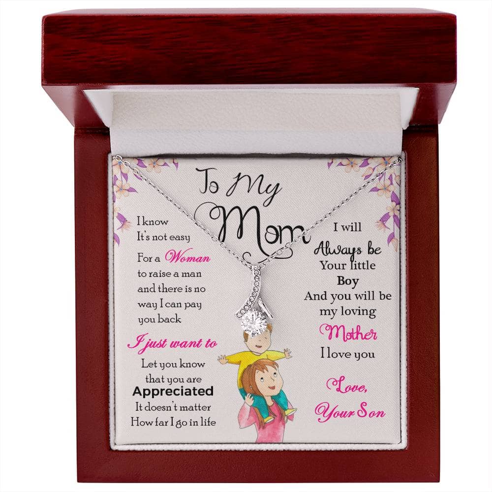 Alt text: "Personalized Mother Necklace in a box - a harmonious confluence of sophistication and timeless grace, crafted with cushion-cut cubic zirconia and a heart-shaped pendant. Adaptable and adjustable chain choices. Packaged luxuriously in a mahogany-style box with LED lighting."