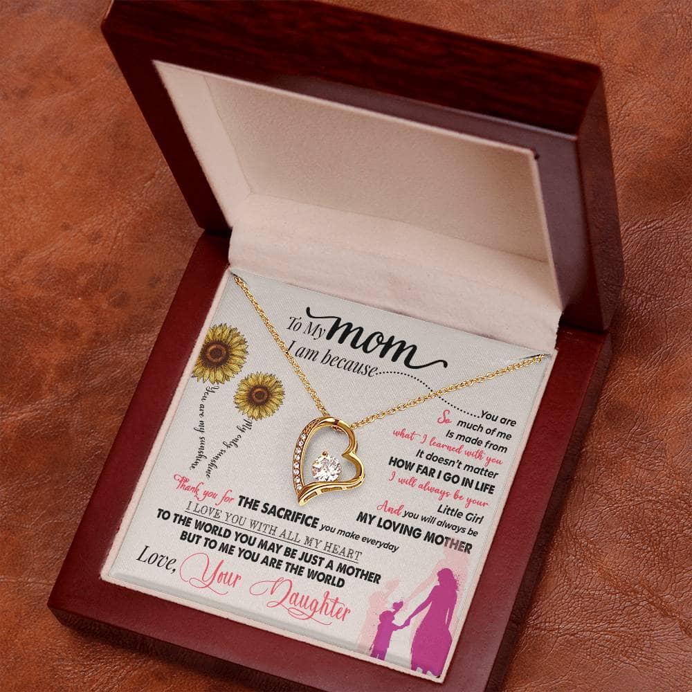 Alt text: "Personalized Mother Necklace in a box with gold heart pendant and diamond, part of the Bespoke Necklace collection"