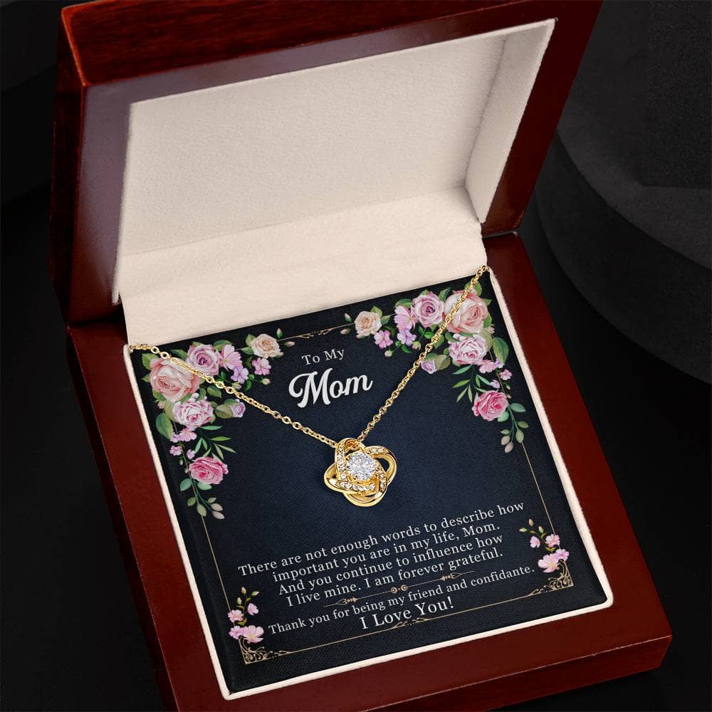 Alt text: "Personalized Mother Necklace - Love Knot pendant with cubic zirconia crystals, symbolizing an unbreakable bond between mother and child."